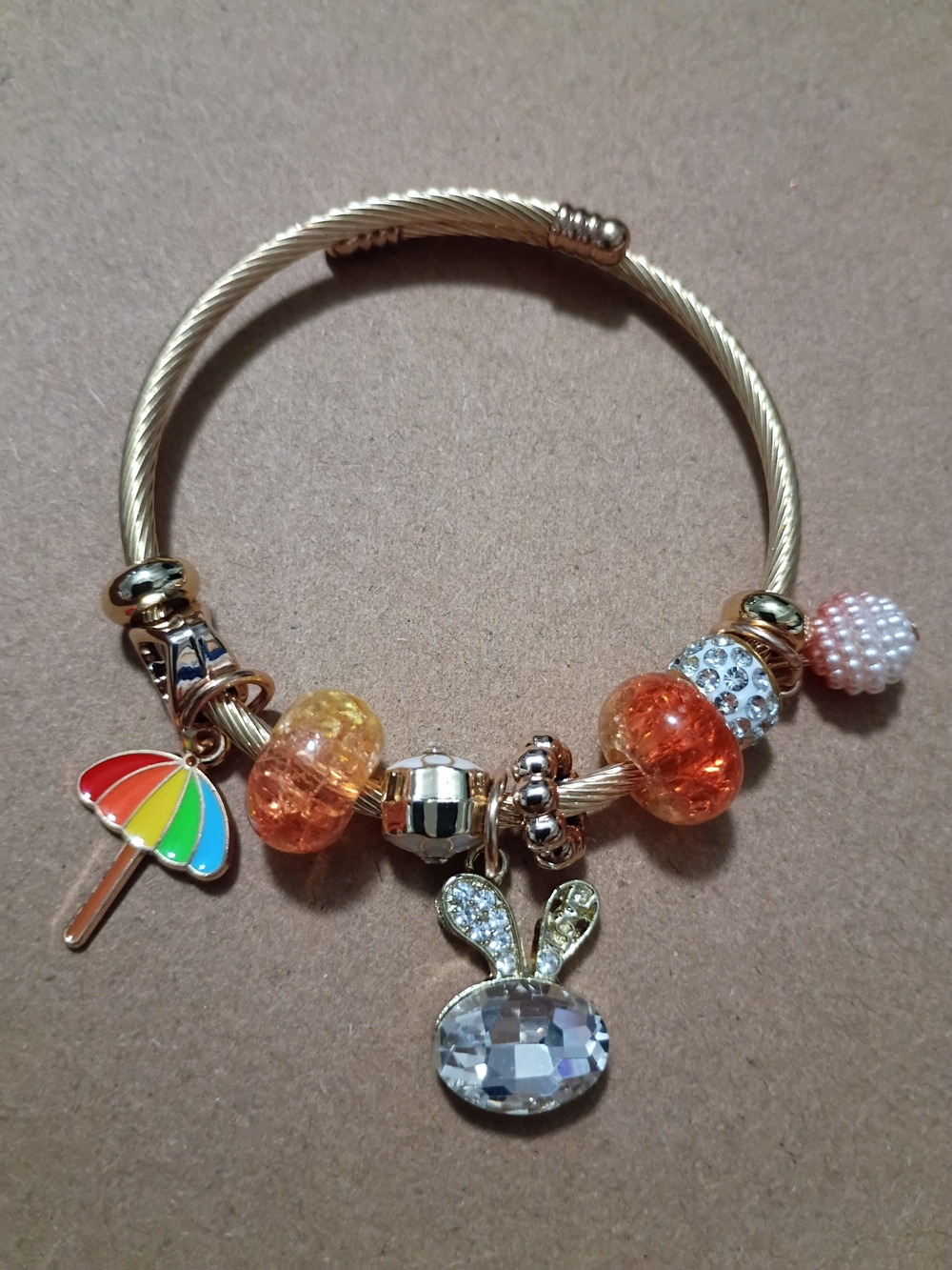 Gold-Tone Charm Bracelet with Orange Beads and Bunny Pendant
